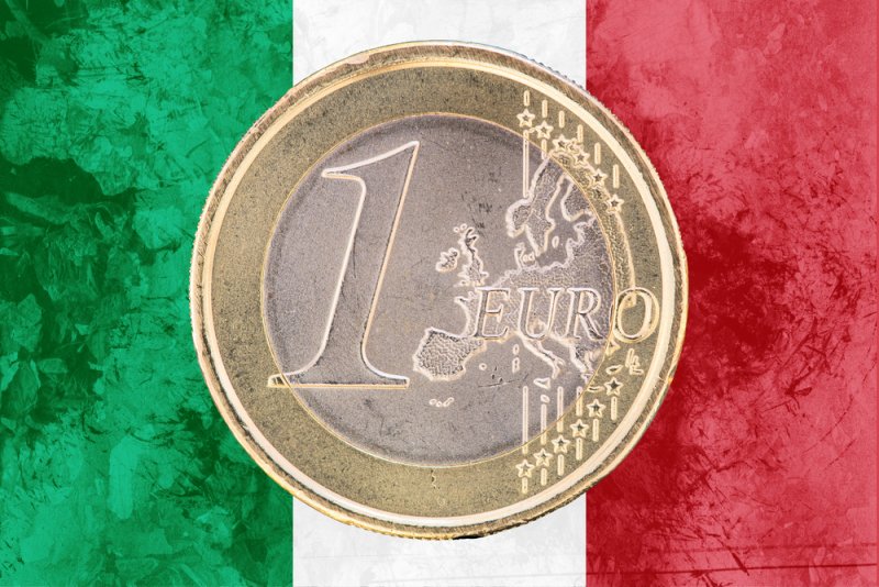 Euro coin on Italian flag